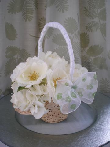 Brompton Floral Designs Wedding Flowers Central London UK NW4 A bridesmaid's basket with white hydrangea and white spray roses 
